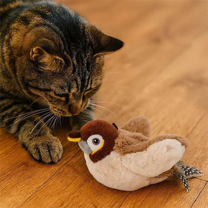Jouet oiseau en peluche brun et blanc, yeux ronds et plume décorative