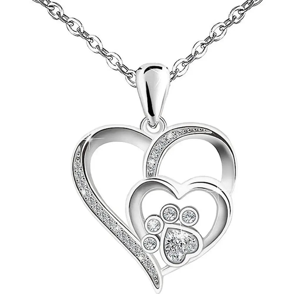 Collier à pendentif cœur argenté, motif patte de chat et strass brillants.