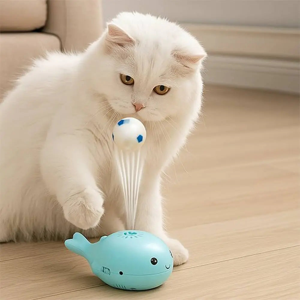 Jouet pour chat dauphin bleu lance-balle avec ventilateur, balle blanche et bleue.
