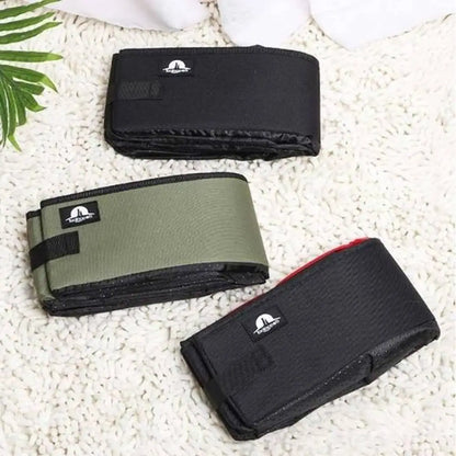 Bac à litière pliable noir et vert, housses compactes avec attaches sur le côté.