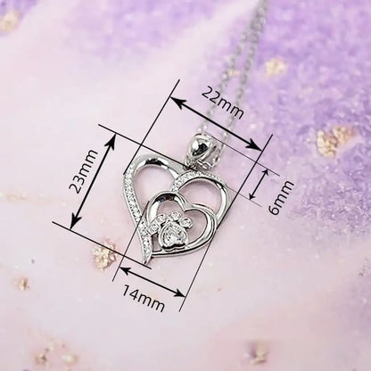Pendentif cœur argenté : dimensions 22 mm × 14 mm × 6 mm.