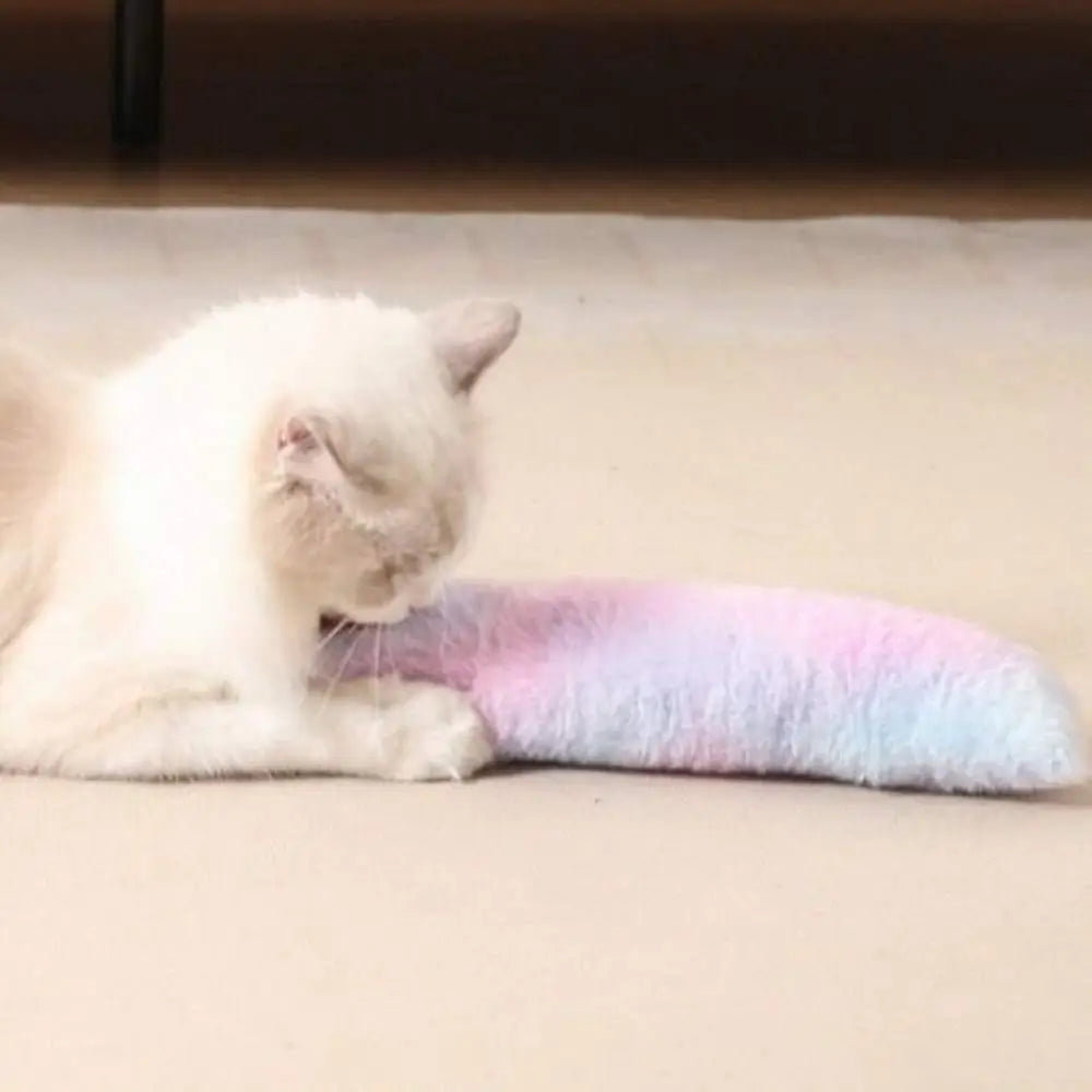 Bâton à macher pour chat en peluche rose clair, allongé et moelleux