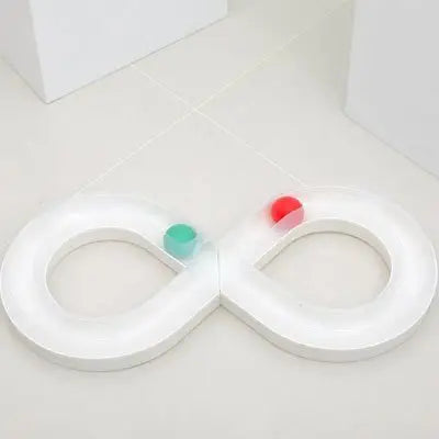Piste de jouet pour chat en plastique blanc avec deux boucles et pions colorés