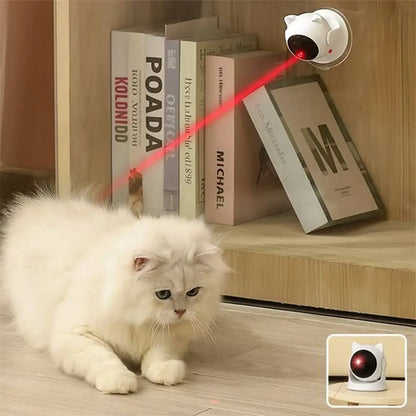 Jouet interactif blanc projettant un faisceau rouge vers un chat blanc couché.