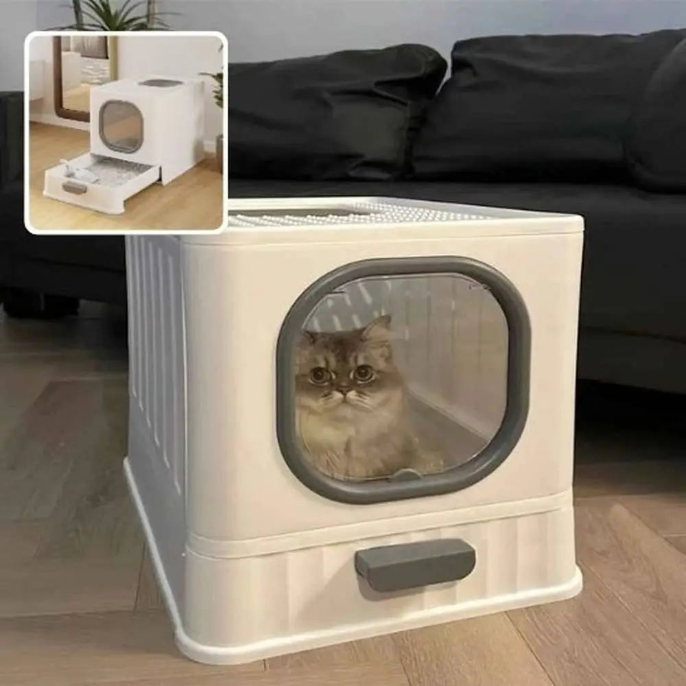 Bac à litière pour chat Ultra-Resist blanc, hublot ovale gris foncé et poignée avant, chat observant.