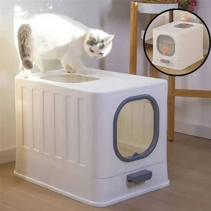 Bac à litière pour chat Ultra-Resist blanc, hublot ovale gris foncé, poignée avant, chat sur le bac.