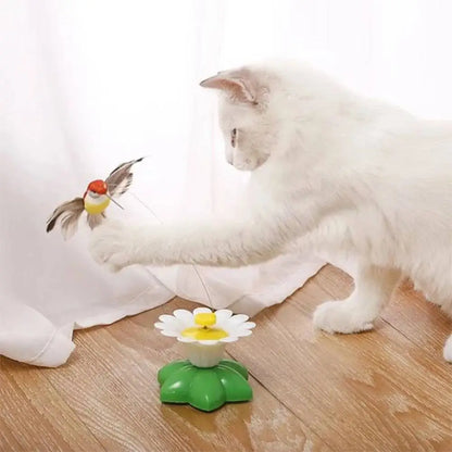 Jouet interactif pour chat : marguerite blanche jaune sur base verte avec petit oiseau
