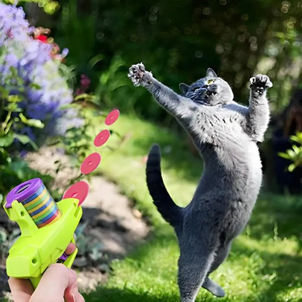 Pistolet lance-disques pour chat vert lime avec tambour arc-en-ciel et disques rouges
