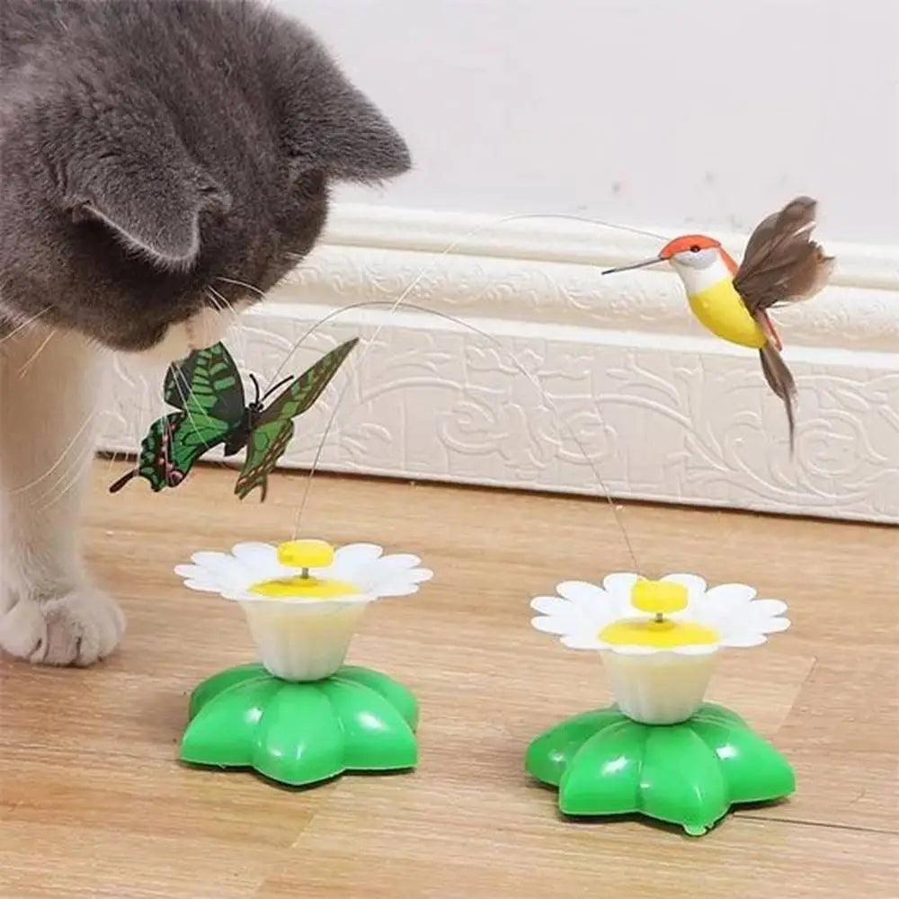 Jouet interactif pour chat avec 2 fleurs blanches sur base verte et mécanisme à papillon