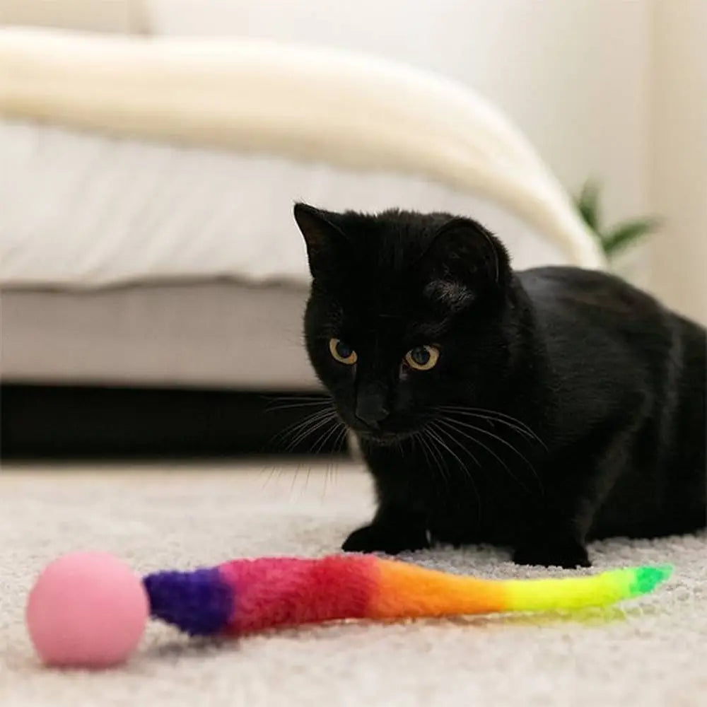 Jouet pour chat interactif FelinActive : bâton en peluche arc-en-ciel et balle rose.