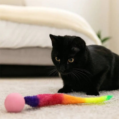 Jouet pour chat interactif FelinActive : bâton en peluche arc-en-ciel et balle rose.