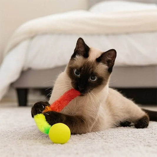 Jouet pour chat interactif FelinActive : bâton en peluche arc-en-ciel et balle jaune.