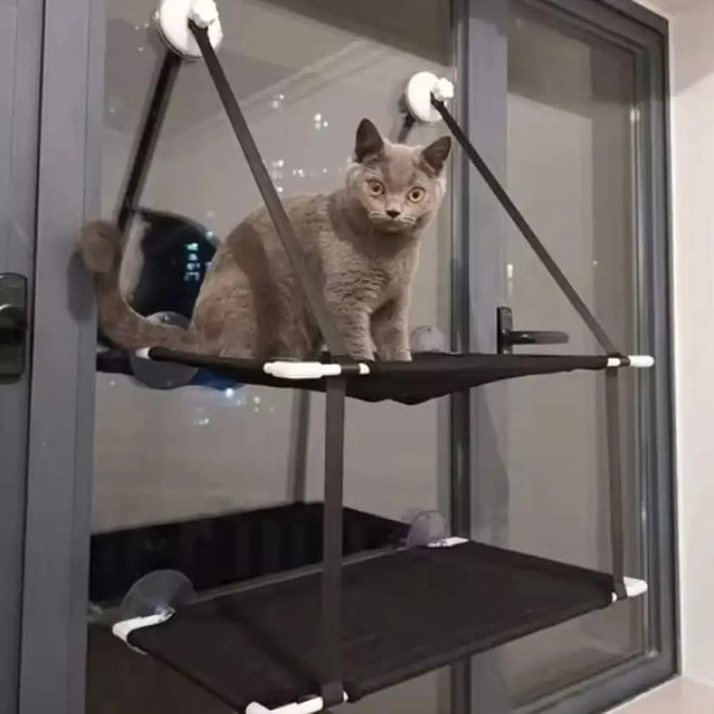 Hamac pour chat de fenêtre Solaris noir avec tissu tendu et attaches au support.