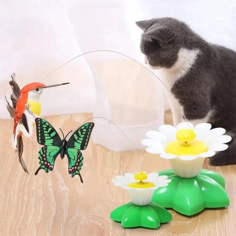 Jouet interactif pour chat avec base verte et marguerites blanches; papillons multicolores
