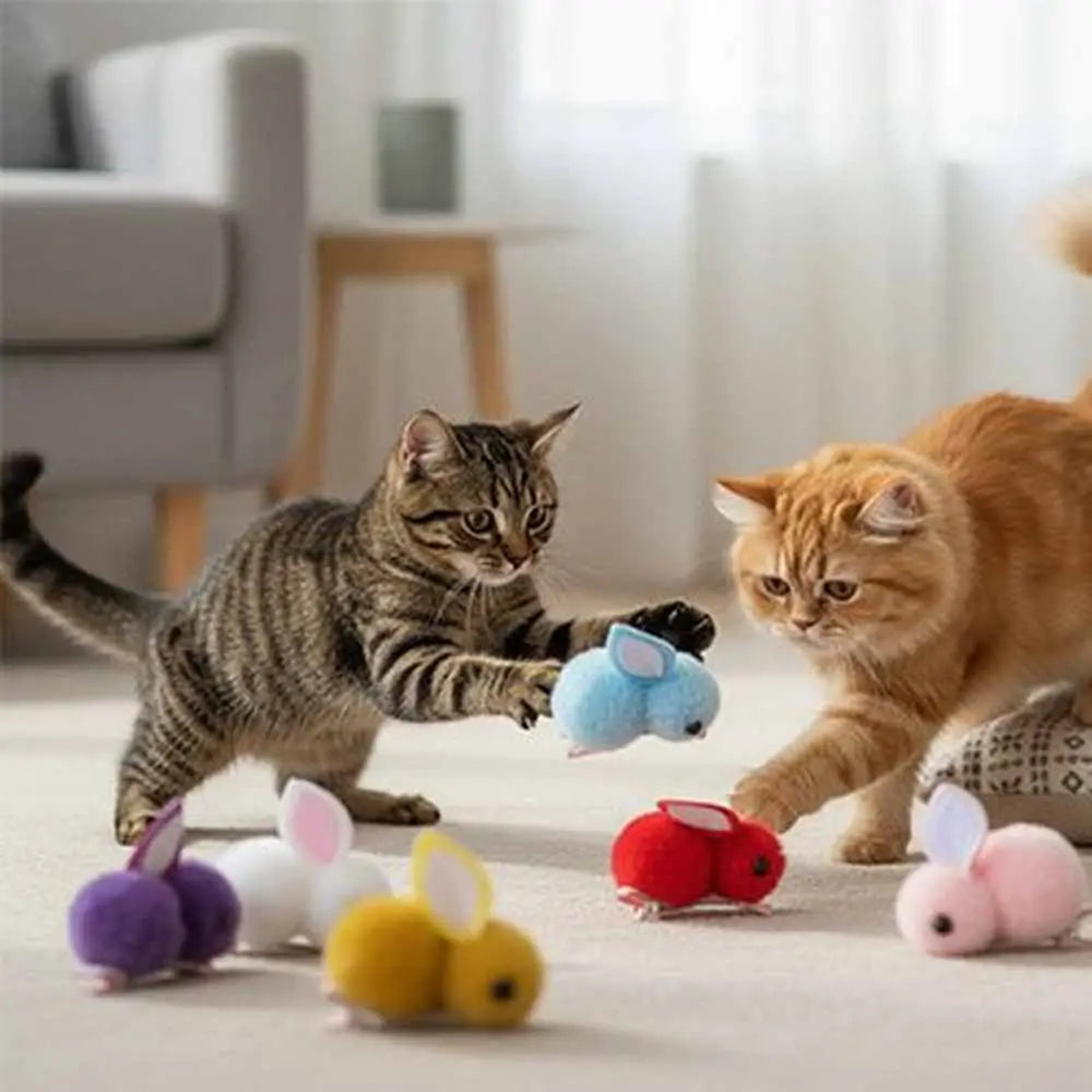 Jeu de peluches lapins pour chat : lapin bleu clair parmi plusieurs peluches